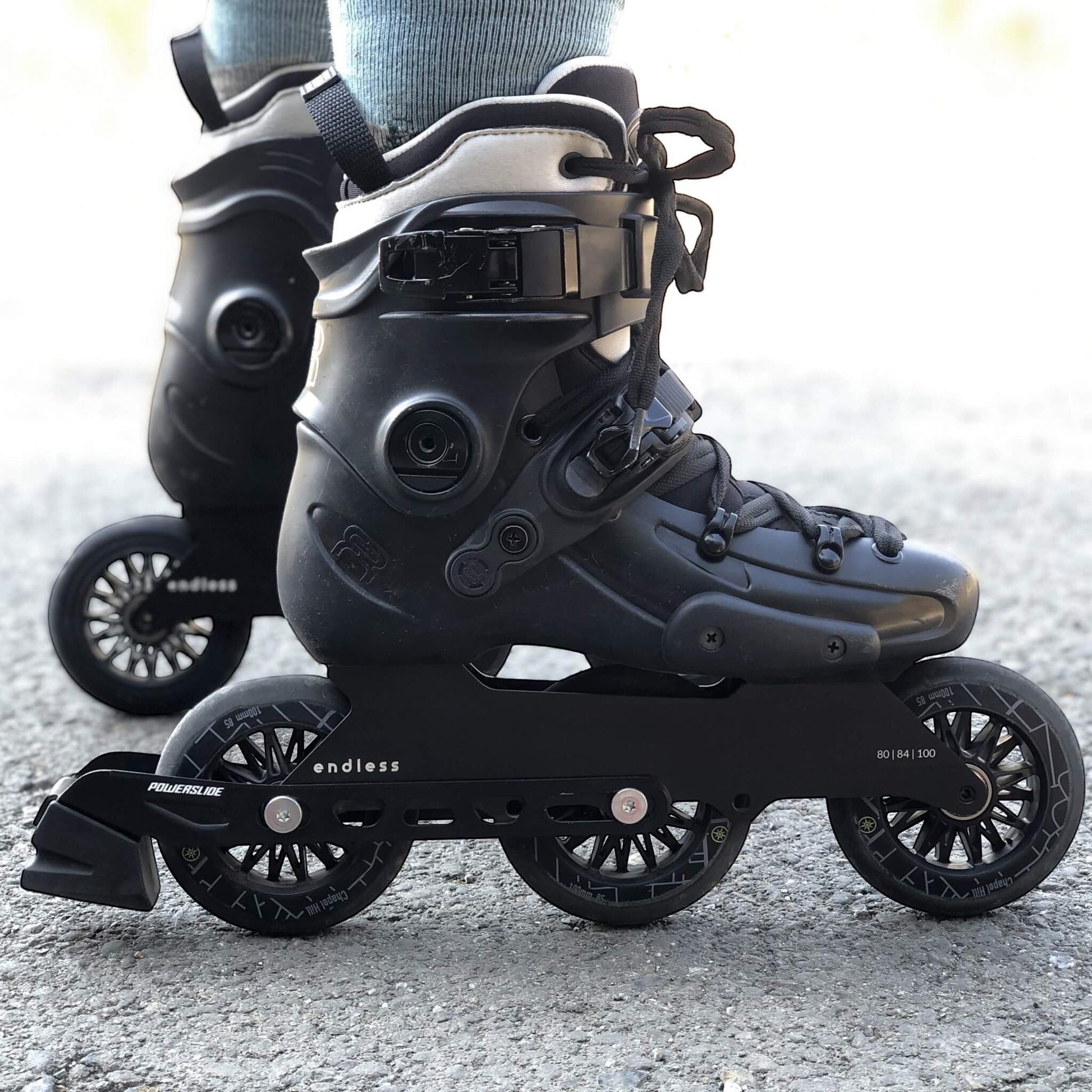 Endless Blading Co. Endless 80 Classic Frame in black mounted on urban skates with 3x100 wheel setup on asphalt.