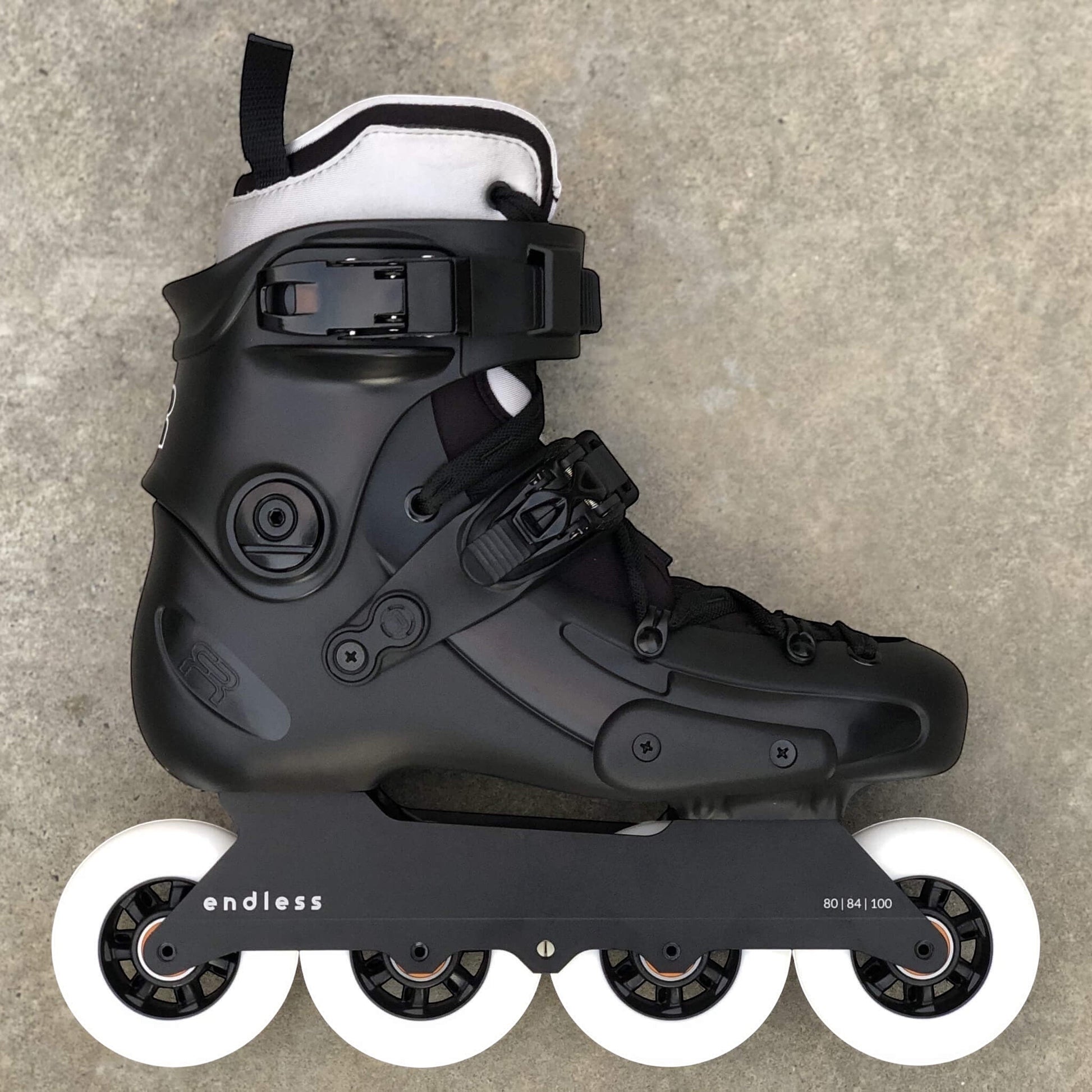 Endless Blading Co. 80 Classic black urban inline skate frame with white wheels on a 165mm mount boot