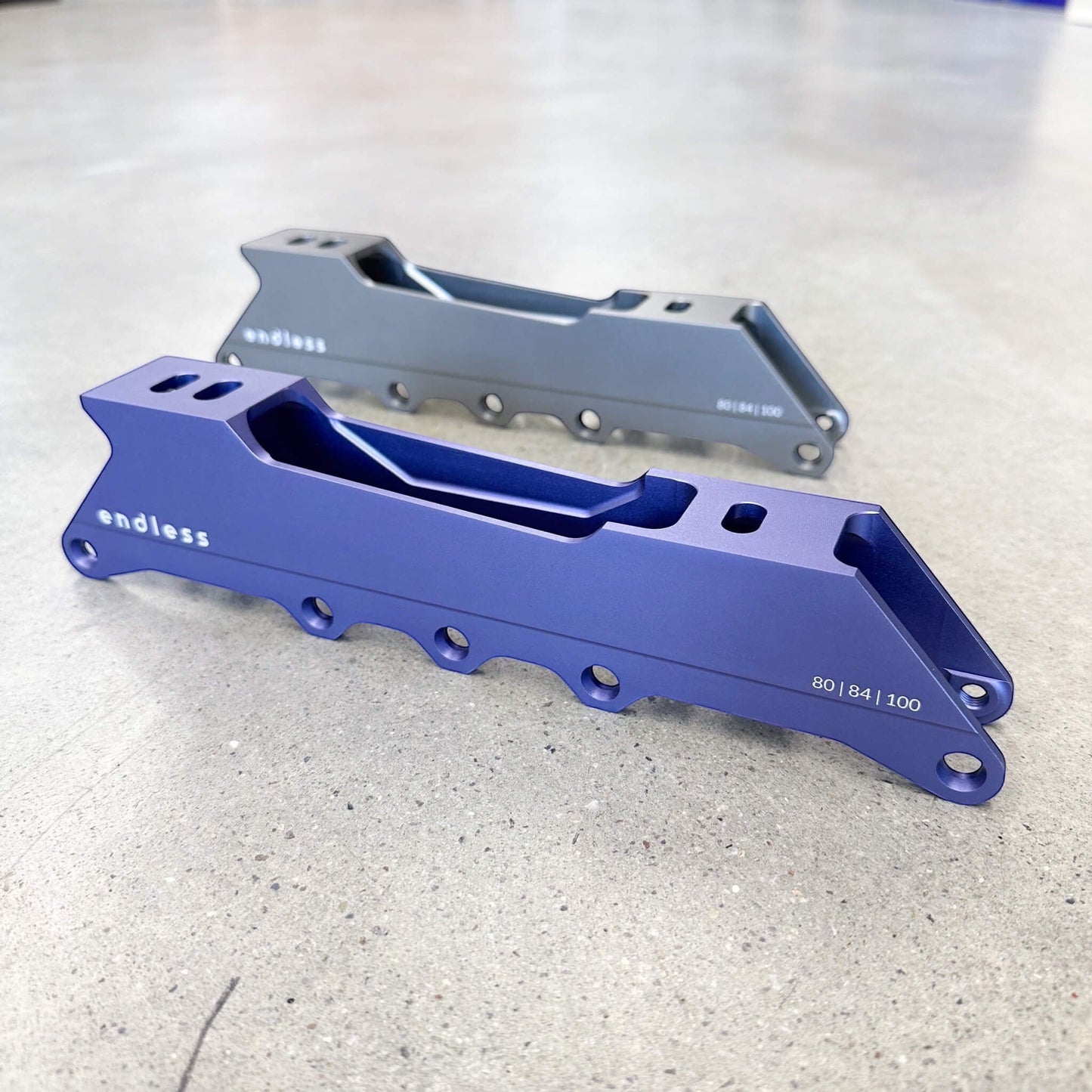 Endless Blading Co. Endless 80 Classic frames in blue and grey CNC-machined aluminum for urban and freeride skates.