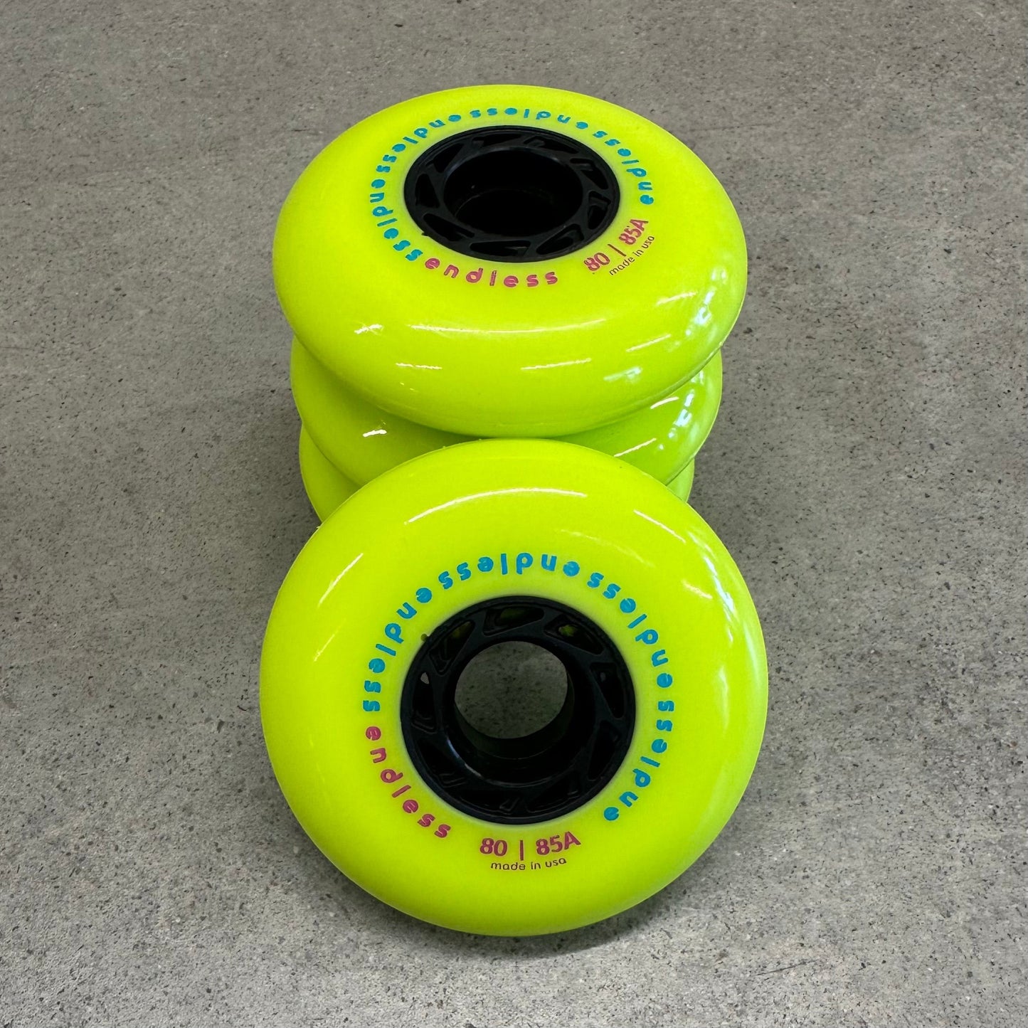 Endless Blading Co. 80 mm neon yellow inline skate wheels with black cores and bullet profile for high performance
