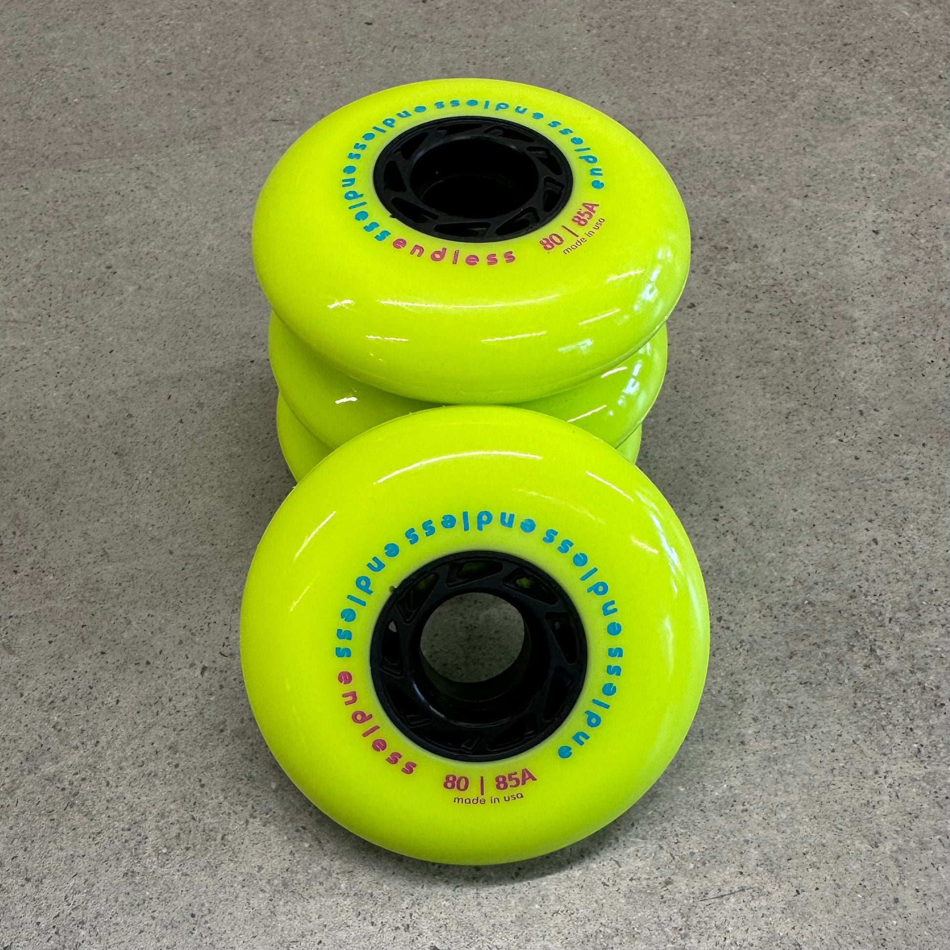 Endless Blading Co. 80 mm neon yellow inline skate wheels with black cores and bullet profile for high performance