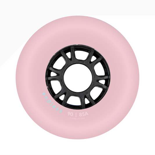 Endless Blading Co. 90mm 85A bullet profile inline skate wheel in light pink with a black high-performance core.