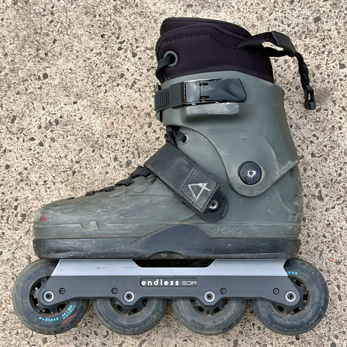 Endless Blading Co. SJR UFS frame with sliders in gray mounted on an gray aggressive inline skate with 84mm wheels
